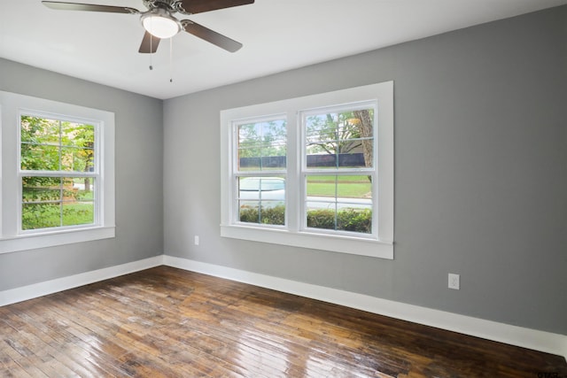 unfurnished room with hardwood / wood-style flooring and ceiling fan