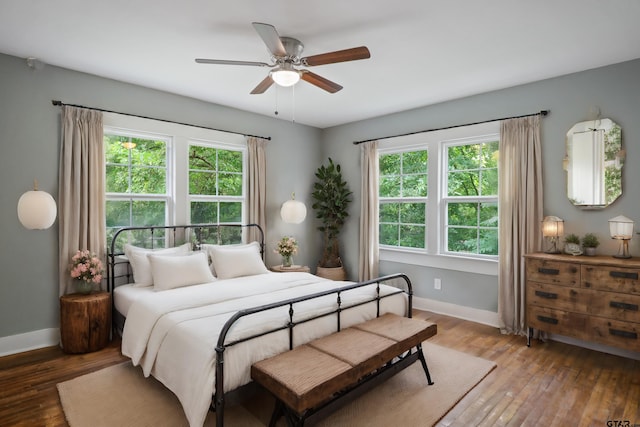 bedroom featuring wood-type flooring and ceiling fan