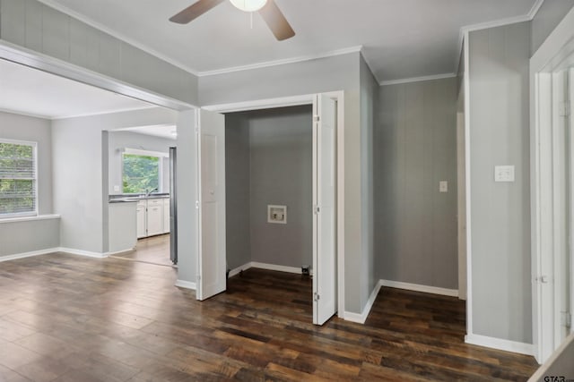 corridor with crown molding and dark wood-type flooring