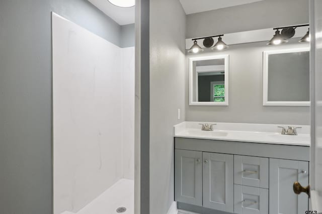 bathroom featuring vanity and walk in shower