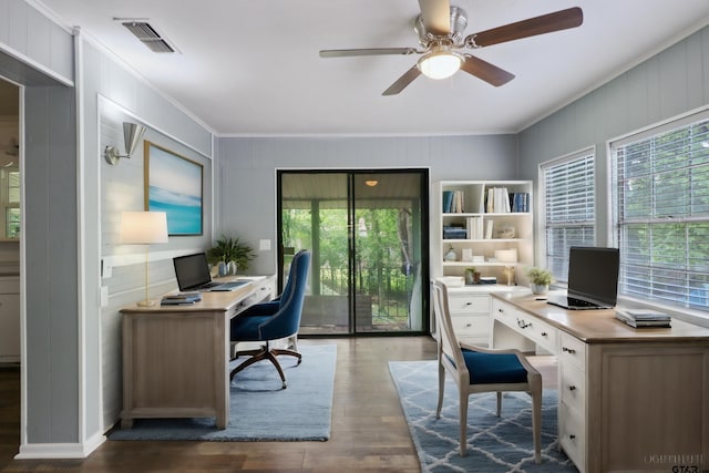 office space featuring dark hardwood / wood-style flooring, ceiling fan, and crown molding