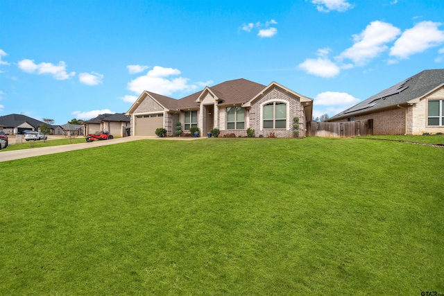 view of front of home featuring a garage and a front lawn