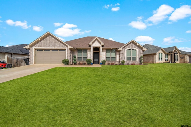 view of front facade featuring a garage and a front lawn