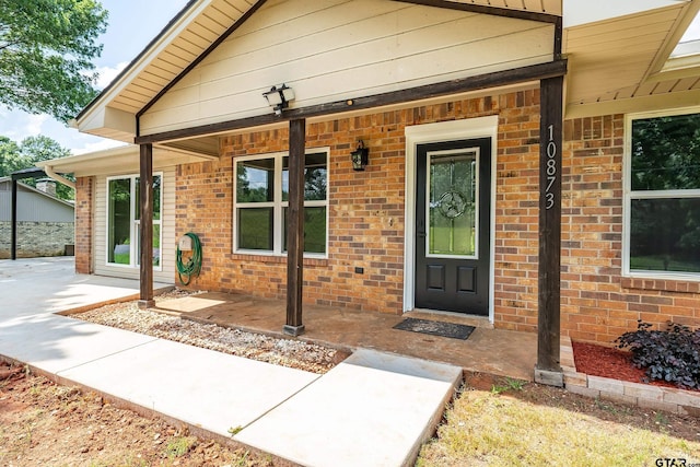 10873 Nix Ln, Whitehouse, TX 75791 - view of exterior entry with covered porch and brick siding
