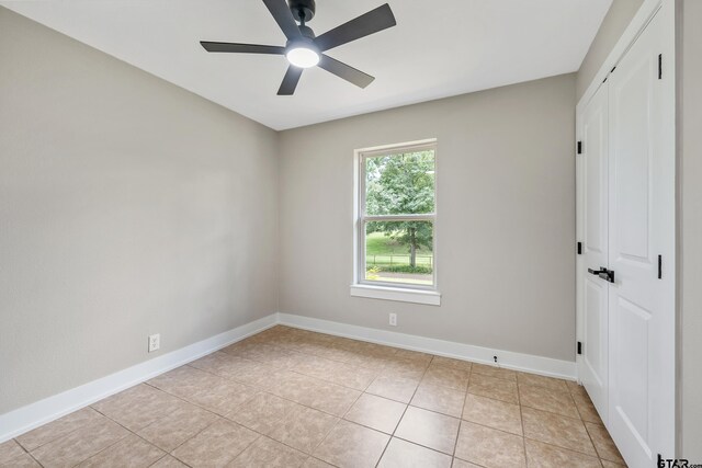 10873 Nix Ln, Whitehouse, TX 75791 - empty room featuring a ceiling fan and light tile patterned floors
