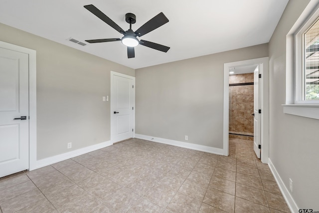 10873 Nix Ln, Whitehouse, TX 75791 - unfurnished bedroom featuring tile patterned floors and a ceiling fan