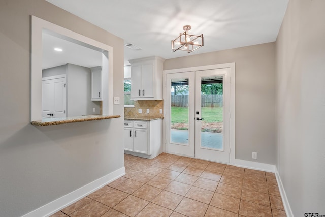 10873 Nix Ln, Whitehouse, TX 75791 - doorway to outside with a chandelier, french doors, and light tile patterned floors