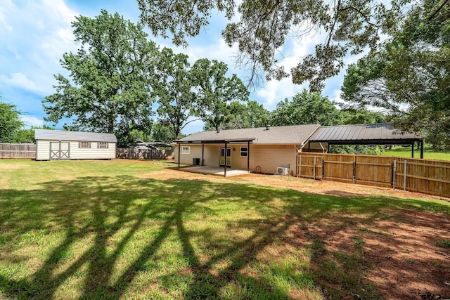 10873 Nix Ln, Whitehouse, TX 75791 - back of property with a patio area, a fenced backyard, and an outbuilding