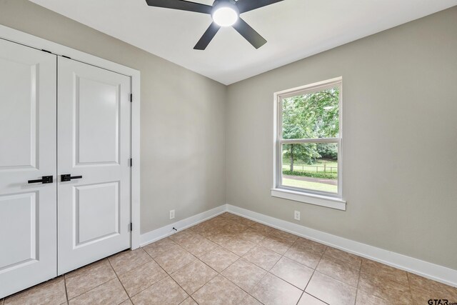 10873 Nix Ln, Whitehouse, TX 75791 - unfurnished bedroom featuring light tile patterned floors and ceiling fan