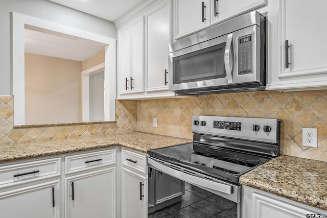 10873 Nix Ln, Whitehouse, TX 75791 - kitchen featuring appliances with stainless steel finishes, white cabinetry, decorative backsplash, light stone counters, and tile patterned flooring