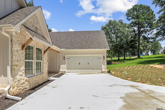 view of home's exterior featuring a lawn and a garage