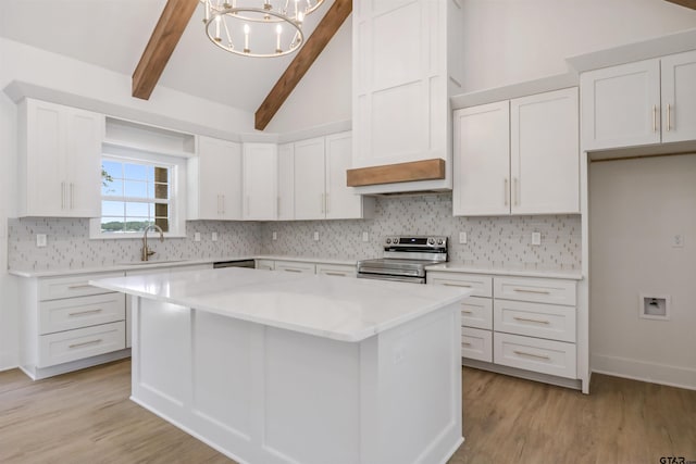 kitchen featuring electric range, white cabinetry, light hardwood / wood-style flooring, and tasteful backsplash