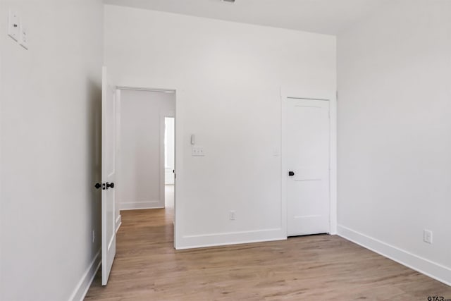 spare room with light hardwood / wood-style floors