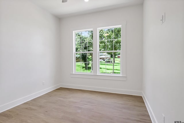 unfurnished room with light hardwood / wood-style floors