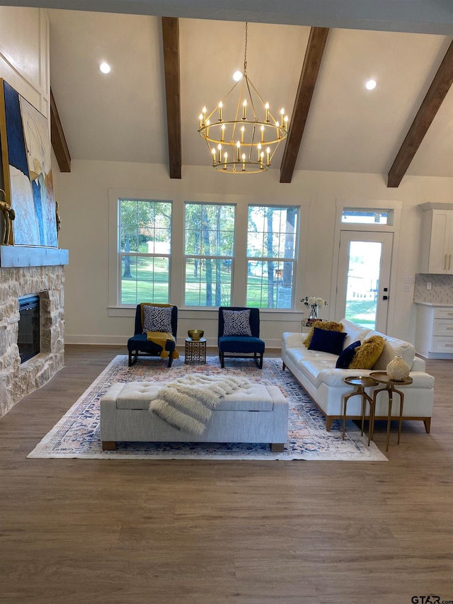 living room with a wealth of natural light, a fireplace, and dark hardwood / wood-style floors