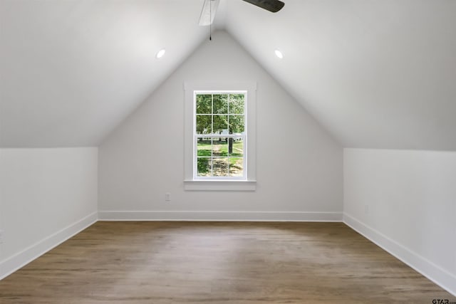 bonus room with ceiling fan, wood-type flooring, and vaulted ceiling