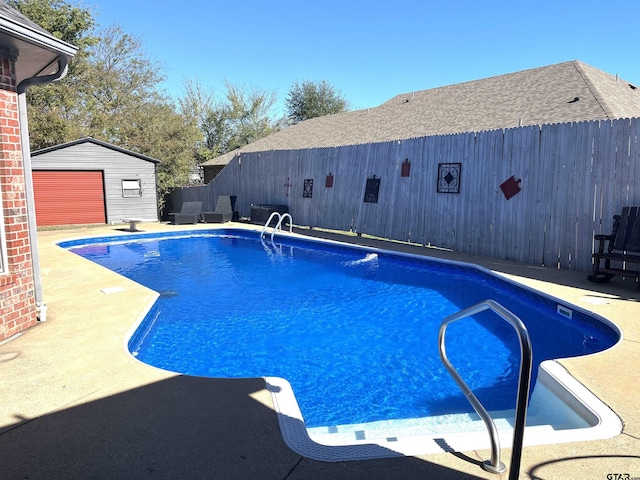 9112 Deerfield Dr, Tyler, TX 75703 - view of swimming pool featuring an outdoor structure, a fenced backyard, a patio, and a diving board