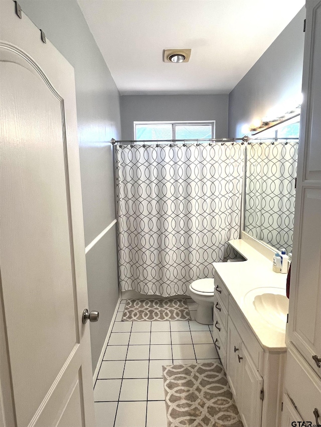 9112 Deerfield Dr, Tyler, TX 75703 - bathroom featuring vanity, tile patterned flooring, toilet, and a shower with shower curtain