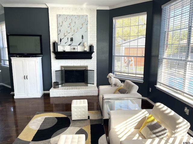 9112 Deerfield Dr, Tyler, TX 75703 - living room featuring crown molding, wood finished floors, baseboards, and a fireplace