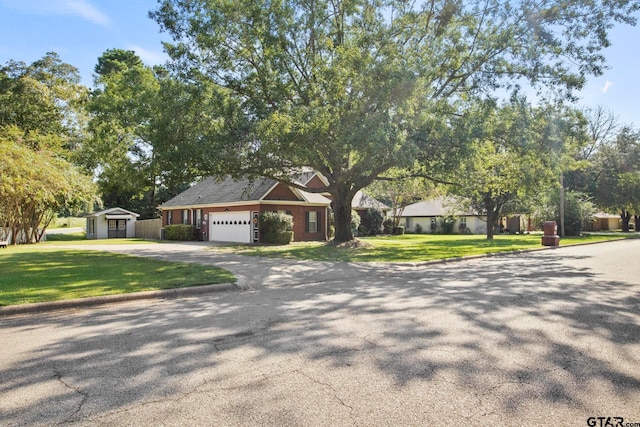 view of front of house with a garage and a front lawn