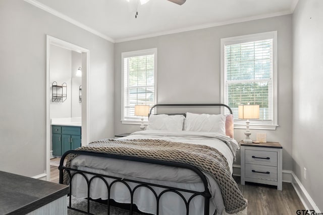 bedroom featuring dark wood-type flooring, multiple windows, ceiling fan, and ensuite bathroom