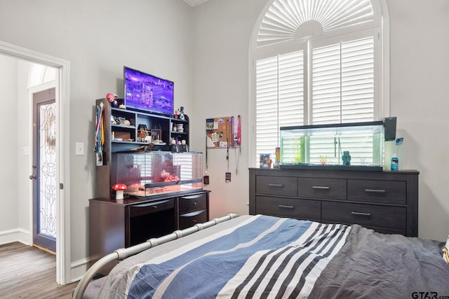 bedroom with wood-type flooring