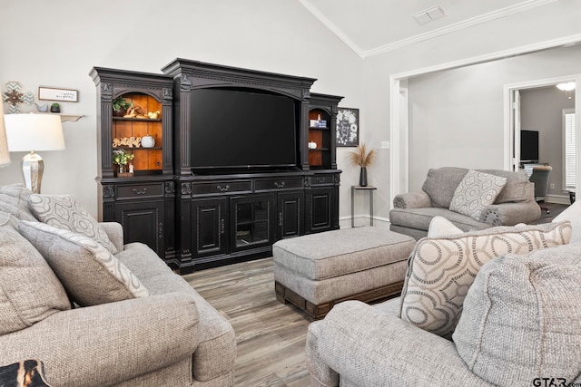 living room featuring high vaulted ceiling, ornamental molding, and light hardwood / wood-style flooring