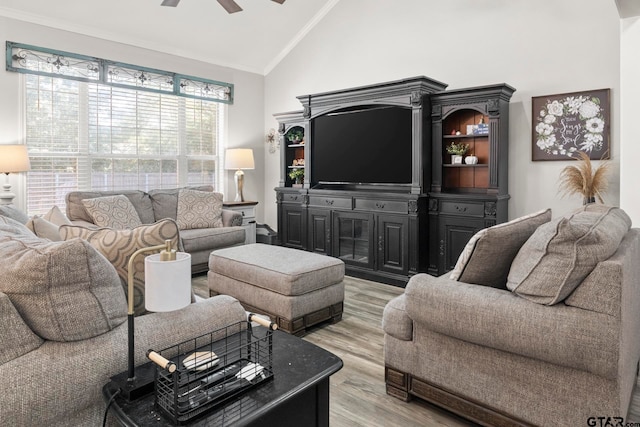 living room featuring ornamental molding, high vaulted ceiling, light hardwood / wood-style flooring, and ceiling fan