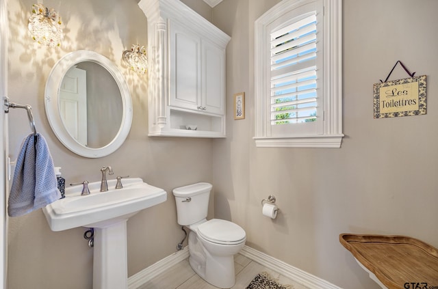 bathroom featuring tile patterned floors and toilet