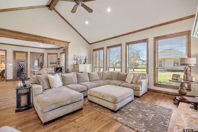 living room featuring ceiling fan, beamed ceiling, high vaulted ceiling, and hardwood / wood-style flooring