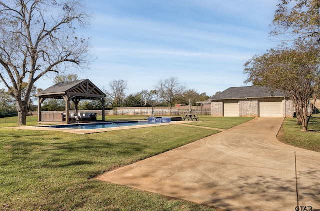 view of home's community with a gazebo, a yard, and a garage