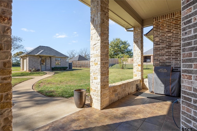 view of patio featuring an outbuilding