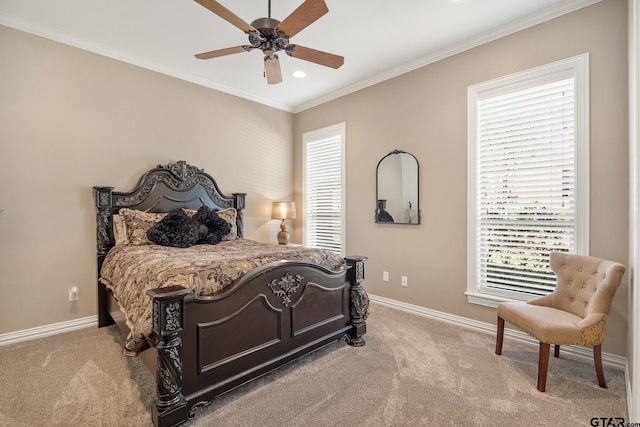 carpeted bedroom featuring ceiling fan and ornamental molding