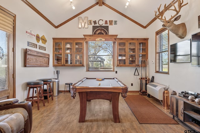 game room with high vaulted ceiling, light hardwood / wood-style flooring, a healthy amount of sunlight, and billiards