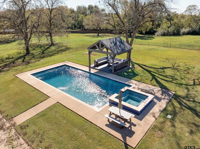 view of swimming pool featuring a gazebo, an in ground hot tub, and a lawn