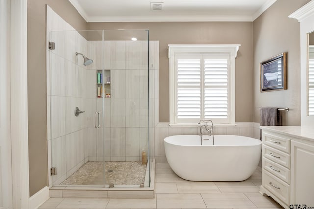 bathroom featuring shower with separate bathtub, vanity, tile walls, and crown molding