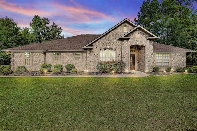 view of front of home with a lawn