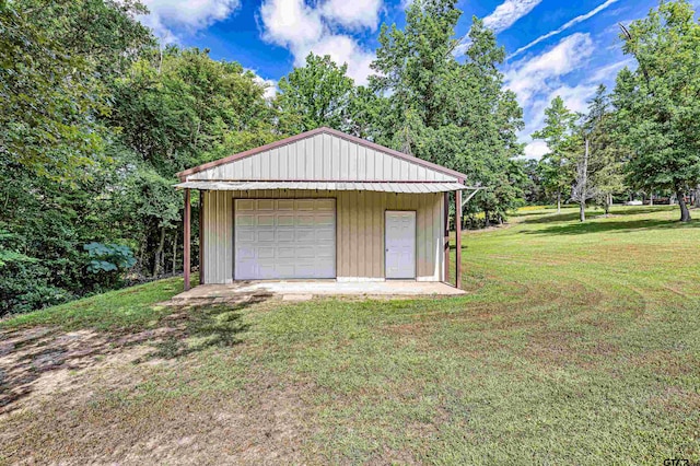 garage with a lawn