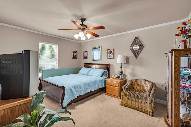 bedroom featuring ornamental molding, light carpet, and ceiling fan