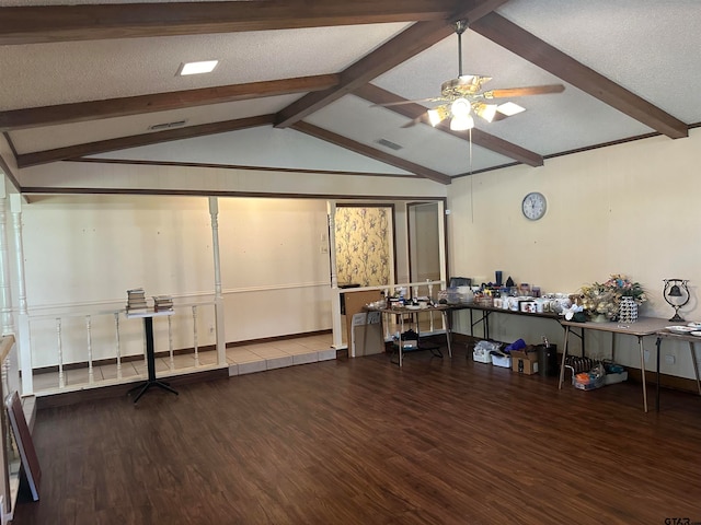 misc room featuring a textured ceiling, dark hardwood / wood-style flooring, vaulted ceiling with beams, and ceiling fan