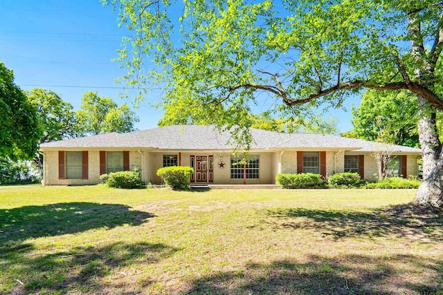 ranch-style home with a front lawn