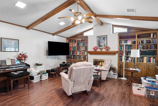 living room featuring dark wood-type flooring, a textured ceiling, lofted ceiling with beams, and a fireplace