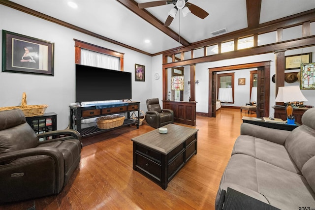 living room with light wood-type flooring, ceiling fan, and beam ceiling