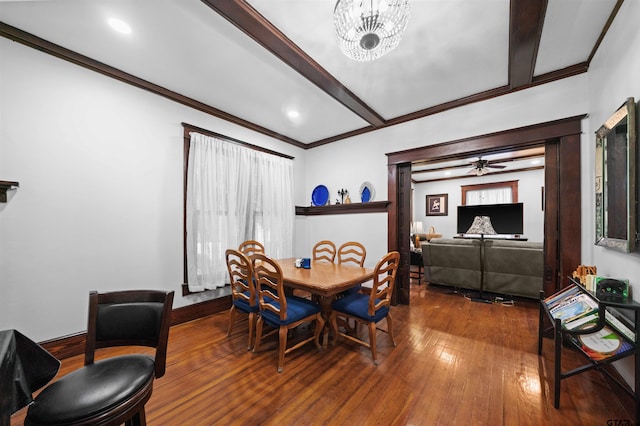 dining space with hardwood / wood-style flooring and ceiling fan with notable chandelier