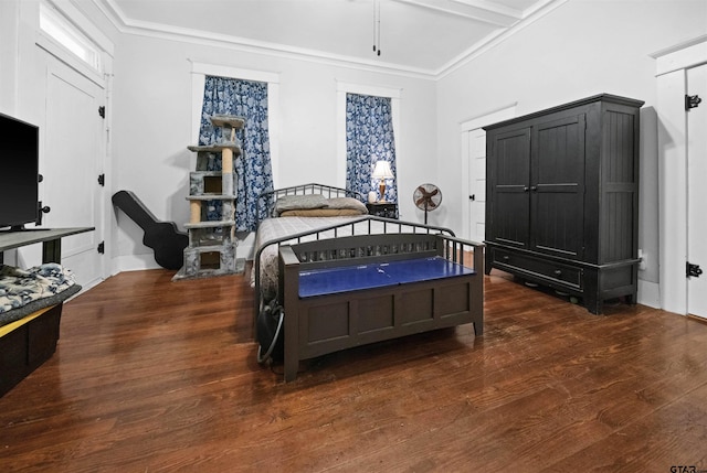 bedroom with crown molding and dark hardwood / wood-style floors