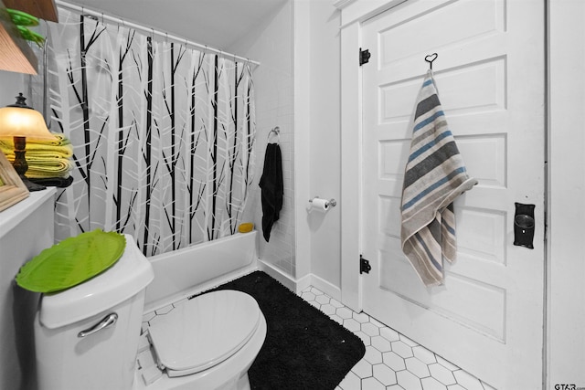 bathroom featuring tile patterned floors, toilet, and shower / bath combination with curtain