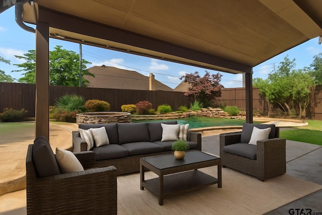2312 Pinehurst Dr, Tyler, TX 75703 - fenced backyard with a patio area and outdoor lounge area