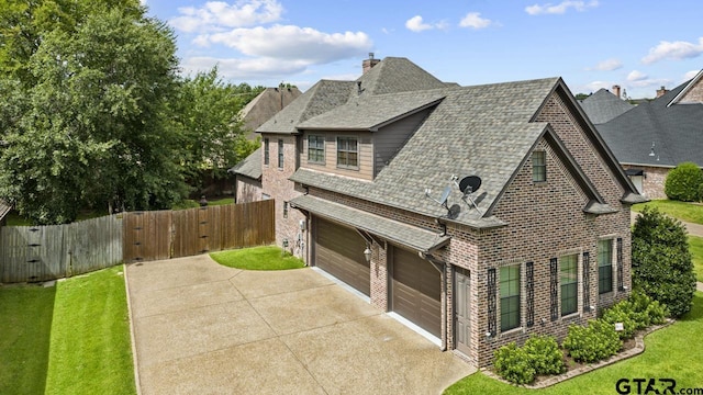 2312 Pinehurst Dr, Tyler, TX 75703 - view of front of property featuring driveway, roof with shingles, a gate, and a garage