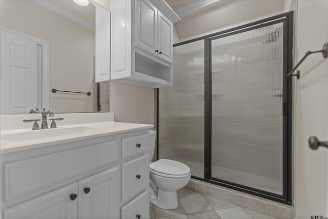 2312 Pinehurst Dr, Tyler, TX 75703 - full bath featuring ornamental molding, vanity, toilet, a shower stall, and tile patterned floors
