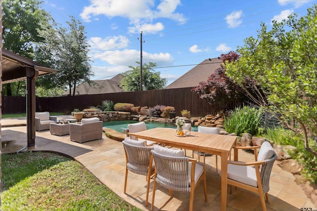 2312 Pinehurst Dr, Tyler, TX 75703 - fenced backyard with a patio area, outdoor lounge area, and outdoor dining space